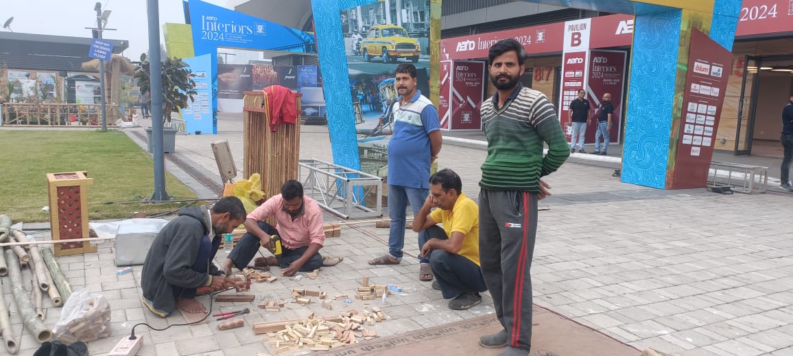 Five-person karigar team portrait, cutting bamboo